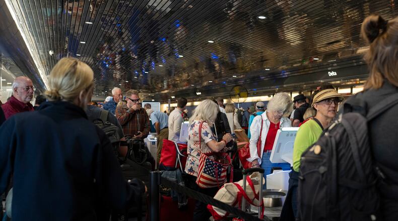 Travelers wait in a long line at the Delta Airlines counter at Milwaukee Mitchell International Airport in Milwaukee on Friday, July 19, 2024. The tech outage on Friday hit airlines especially hard, and Delta has been the slowest to restore its operations. (Hiroko Masuike/The New York Times)