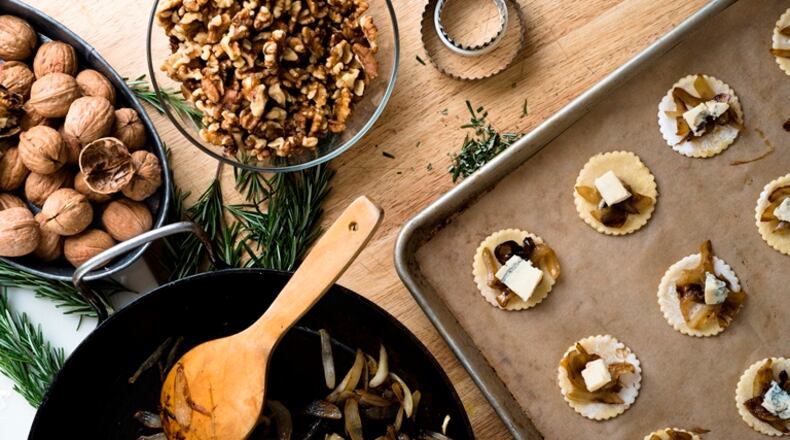 Little onion tarts with gorgonzola and walnuts, in New York, Nov. 16, 2015. These savory little tarts are no more difficult than baking a batch of cookies.