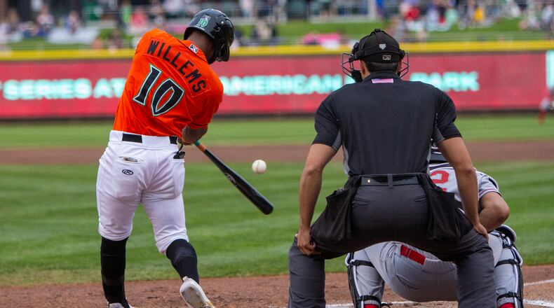 Dragons infielder Jonathan Willems hits an RBI single in the second inning of Friday night's game against Great Lakes at Day Air Ballpark.
