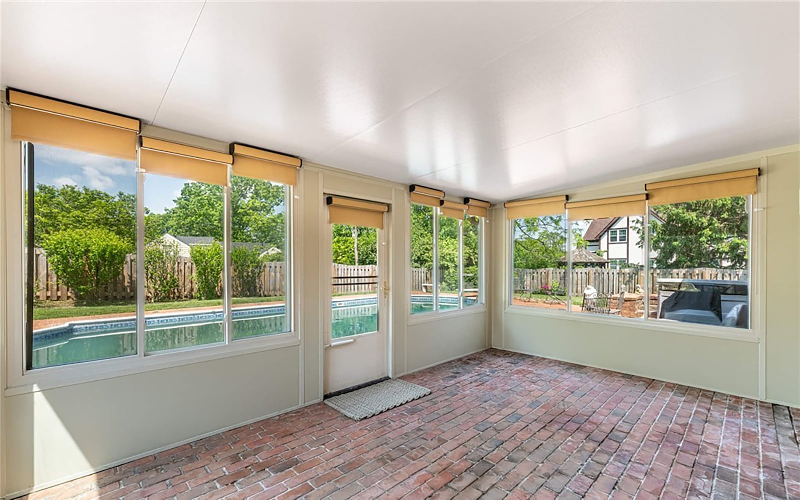 the Florida room/Lanai has a brick paver floor, shades on all the windows and a door that opens to the pool area. CONTRIBUTED