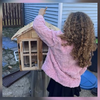 Pam Chandler's daughter, Jasmine, working on The Little Free Pantry, a place where people in her neighborhood can get non-perishable items at no cost. “We decided it would be a good homeschool project to make something more permanent to help our community,” Chandler said.