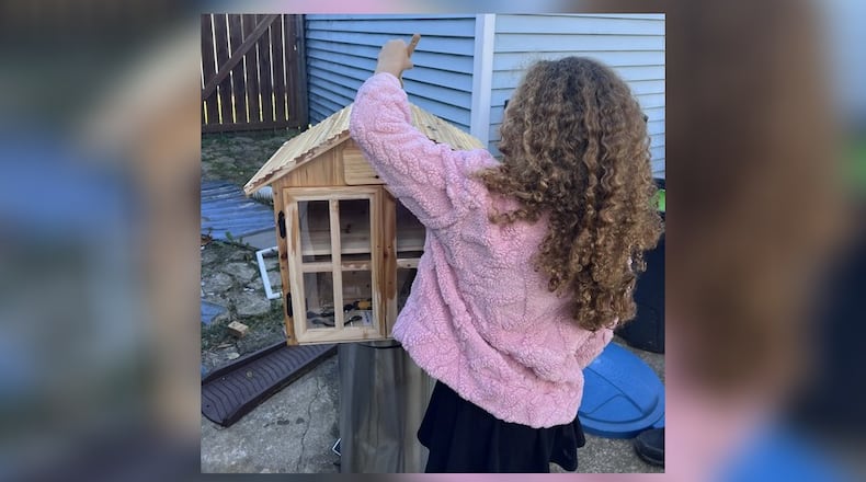 Pam Chandler's daughter, Jasmine, working on The Little Free Pantry, a place where people in her neighborhood can get non-perishable items at no cost. “We decided it would be a good homeschool project to make something more permanent to help our community,” Chandler said.