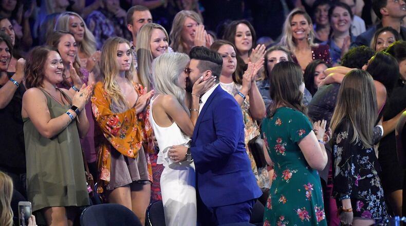 NASHVILLE, TN - JUNE 06: Shay Mooney of Dan + Shay kisses Hannah Billingsley at the 2018 CMT Music Awards at Bridgestone Arena on June 6, 2018 in Nashville, Tennessee. (Photo by Mike Coppola/Getty Images for CMT)
