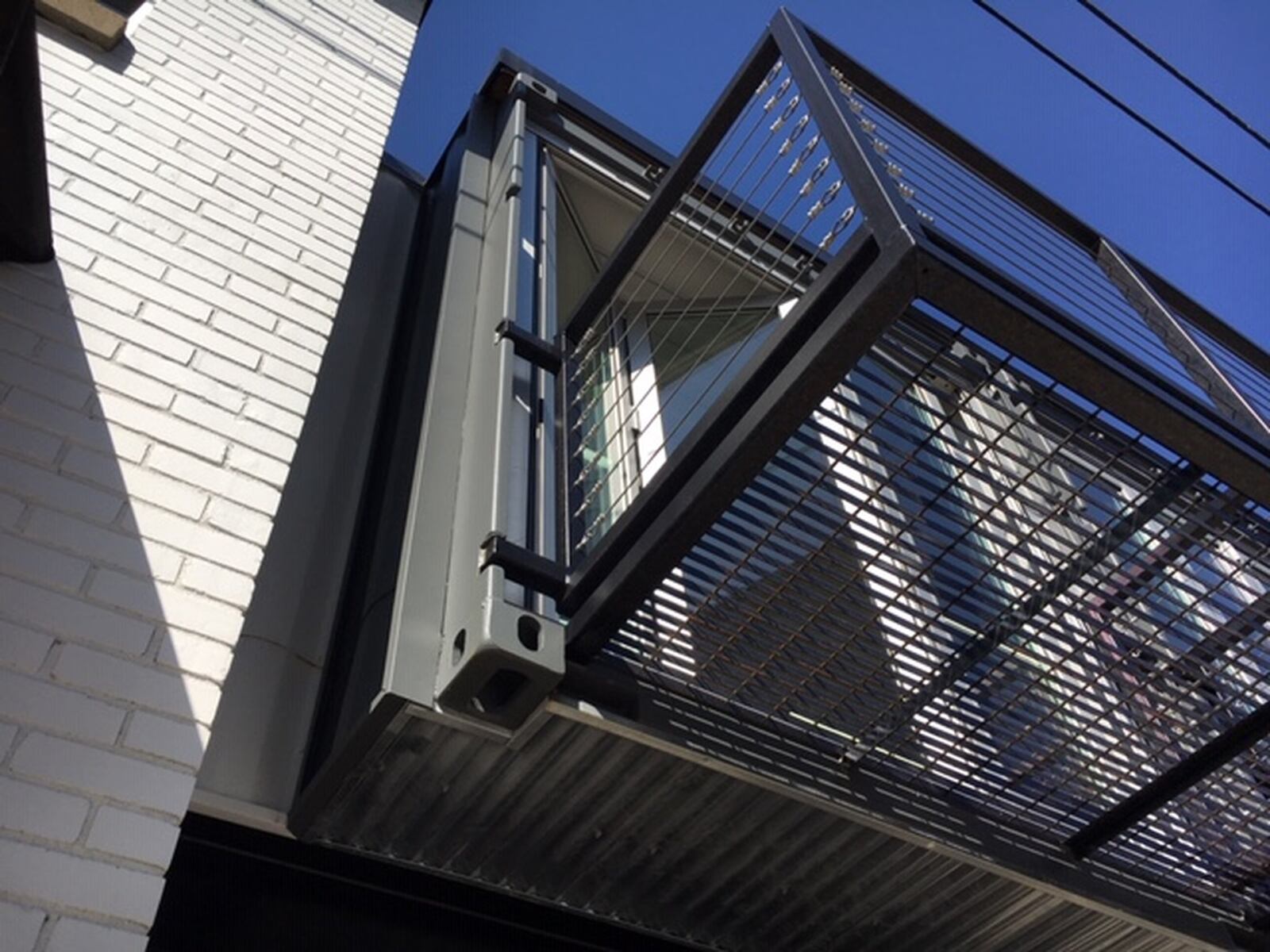 An exterior view of a corner of a shipping container used to expand and connect Moda4’s second-floor work spaces at 23 Wayne Ave. THOMAS GNAU/STAFF