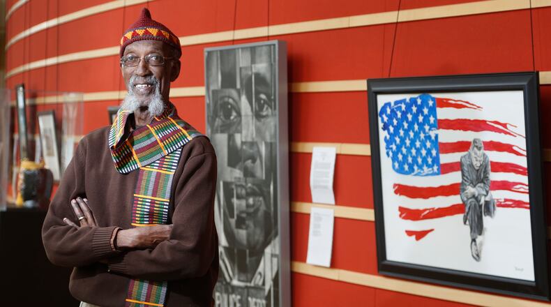 Willis "Bing" Davis was the curator of the 2018 Visual Voices art exhibit, "The Preacher, The Poet, The Vision." Artists were tasked with commemorating Dr. Martin Luther King, Jr. through the literary voice of Dayton poet Paul Laurence Dunbar. LISA POWELL / STAFF