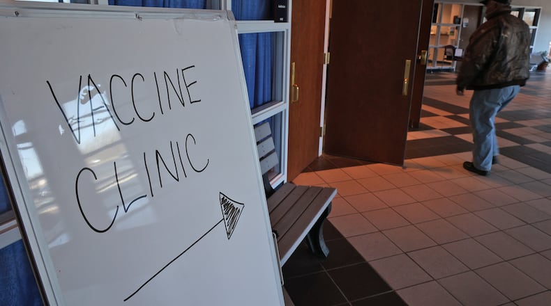 FILE PHOTO A man walks into a Champaign County COVID-19 clinic at the government center in Urbana. BILL LACKEY/STAFF