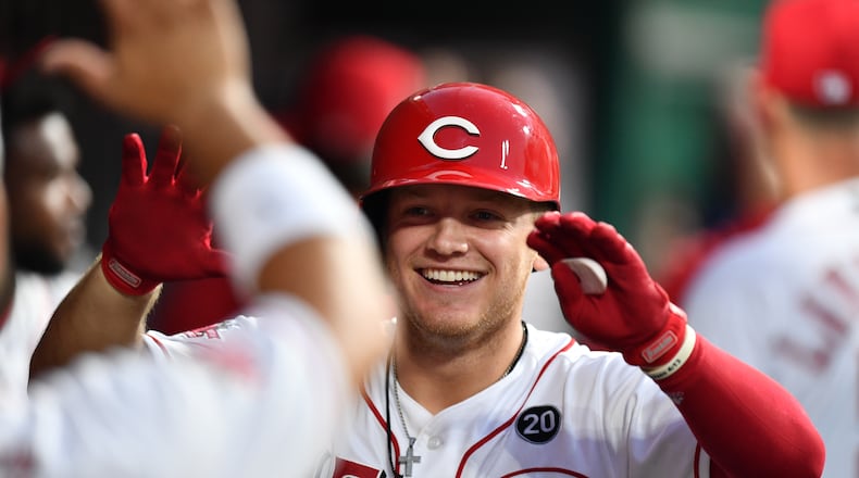 CINCINNATI, OH - JULY 20: Josh VanMeter #17 of the Cincinnati Reds celebrates in the dugout after hitting a two-run home run in the seventh inning against the St. Louis Cardinals at Great American Ball Park on July 20, 2019 in Cincinnati, Ohio. Cincinnati defeated St. Louis 3-2. (Photo by Jamie Sabau/Getty Images)