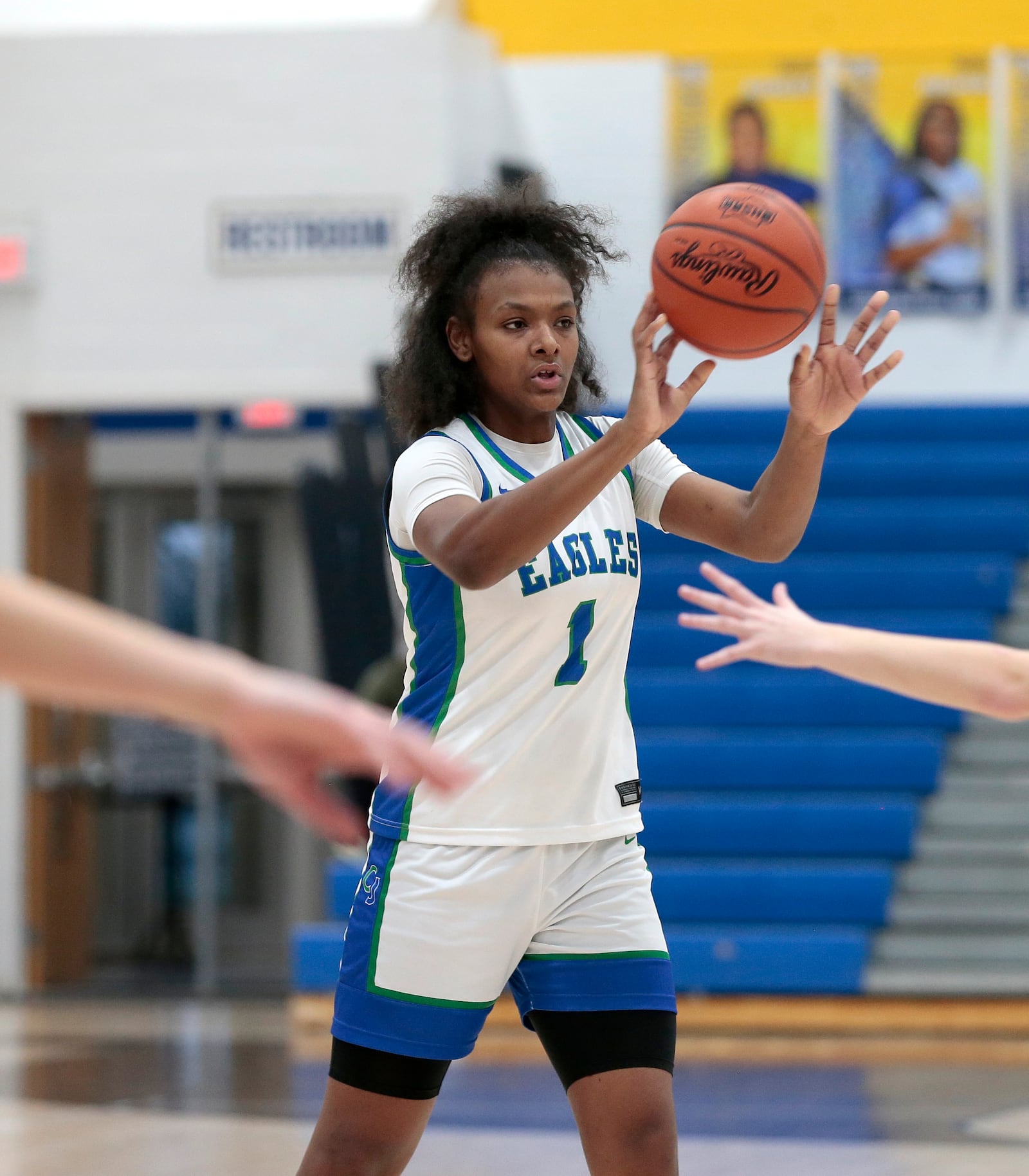 CJ freshman Ja'Kyiah Cook throws a pass to a teammate after assessing the defense. CJ defeated Franklin 73-39 in a Division III district semifinal game on Wednesday, Feb. 25, 206, in Springfield. STEVEN WRIGHT / STAFF