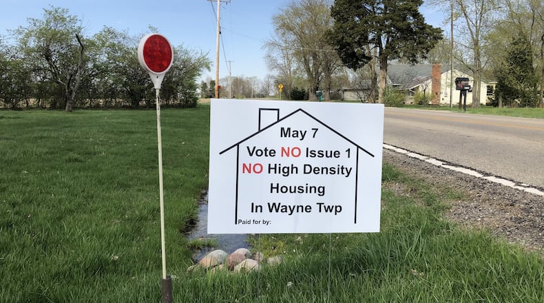 Supporters of a referendum on a residential subdivision planned in Wayne Twp., Warren County, said they had 25 signs promoting passage. STAFF/LAWRENCE BUDD