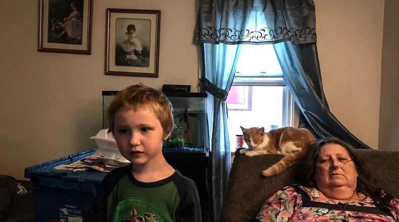 Verna Koger and her grandson, Blake Adamson, lost power after a tree knocked down power lines Monday at their Ontario Avenue home in Harrison Twp. Koger needs oxygen to breathe and is afraid the prolonged outage will harm her health.