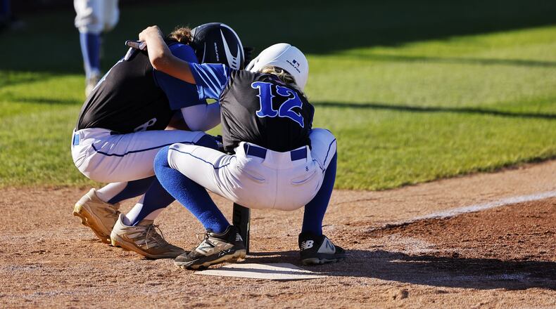 Hamilton's Cash Brown (12) comforts teammate Carter Jackson at home plate after their 1-0 loss to Kentucky's North Laurel Little League in a Great Lakes Region elimination baseball game Wednesday, Aug. 10, 2022 at the Little League Central Region Complex in Whitestown, IN. NICK GRAHAM/STAFF