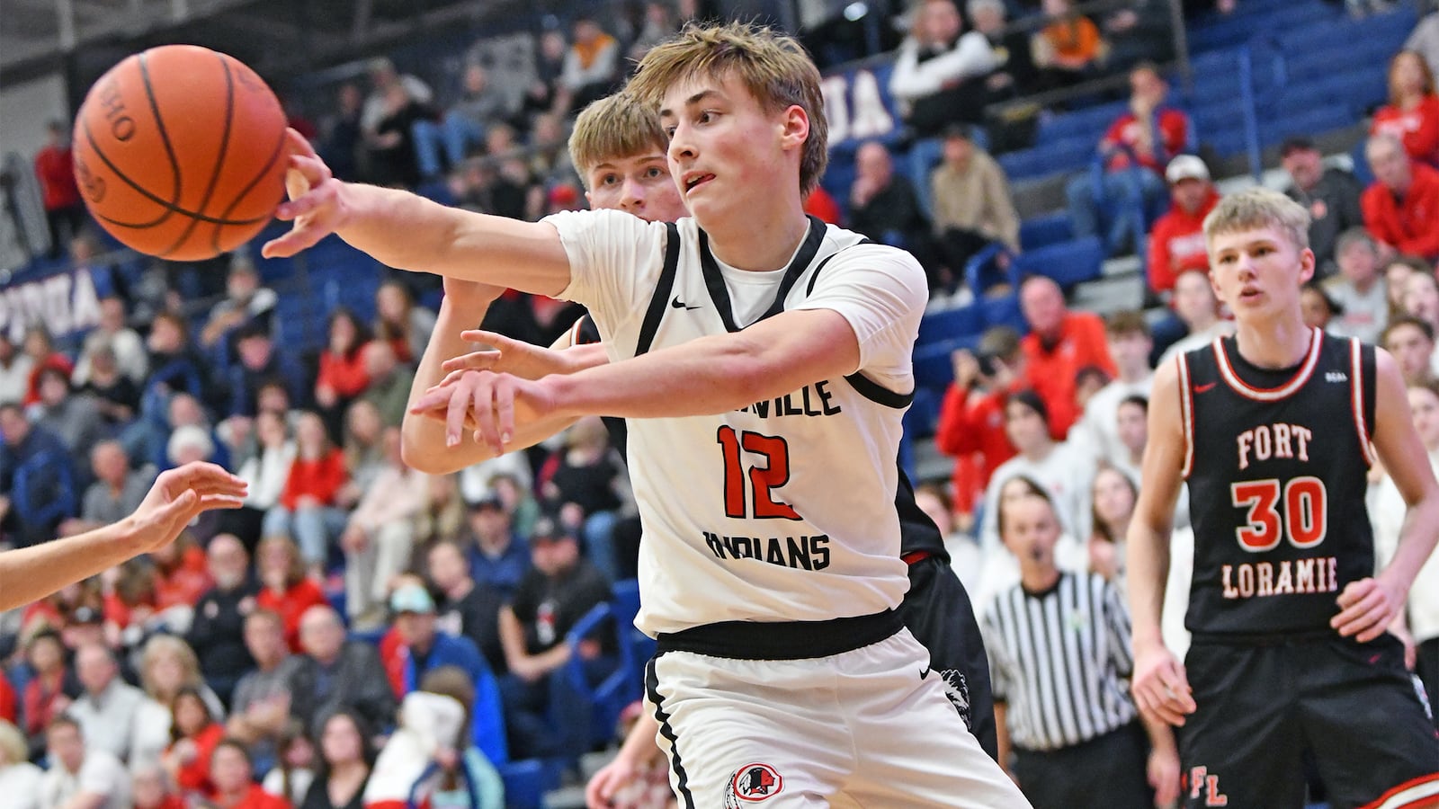 Cedarville's Cooper Hardy fires a pass during Tuesday night's 45-44 Division VII tournament win over Fort Loramie. Jeff Gilbert/Contributed