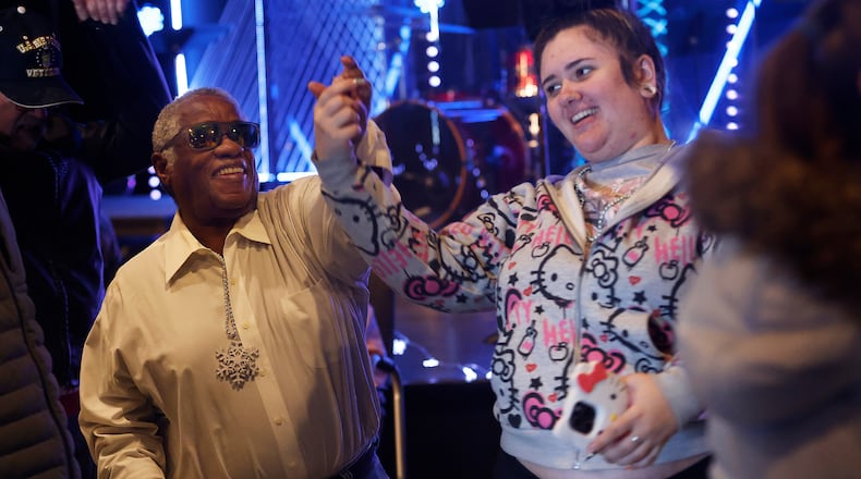 Corn Culpper dances with Tessa Potts, Tuesday, Dec. 3, 2024, at the Developmental Disabilities Holiday Dance at the Christian Life Center, hosted by Goodwill Easterseals Miami Valley. MARSHALL GORBY\STAFF