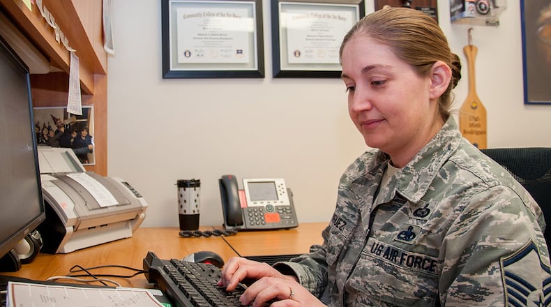 Master Sgt. Misti Rodriguez, Academic Coding Branch superintendent, inputs a transcript into the Air Force Military Personnel Data System to update an officer’s record. Two Airmen at the Coding Branch, including Rodriguez, update more than 1,000 transcripts a month in support of some 130,000 total force Air Force officers. (U.S. Air Force photo/John Harrington)