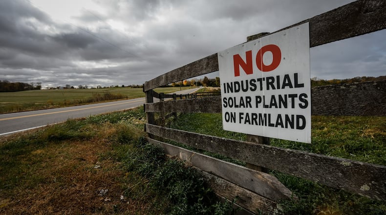 Opposition to large solar panel installations can be spotted on Wilberforce Clifton Road in Cedarville Twp. between Central State and Clifton. JIM NOELKER/STAFF