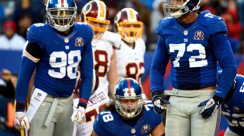 EAST RUTHERFORD, NJ - DECEMBER 14: Kerry Wynn #72 of the New York Giants celebrates a stop against the Washington Redskins during their game at MetLife Stadium on December 14, 2014 in East Rutherford, New Jersey. (Photo by Alex Goodlett/Getty Images)