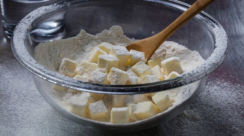 No need to cut the butter into the flour with this method. Instead roughly smash the butter cubes, then stir in water and knead briefly. (Zbigniew Bzdak/Chicago Tribune/TNS) Joan Moravek / food styling)