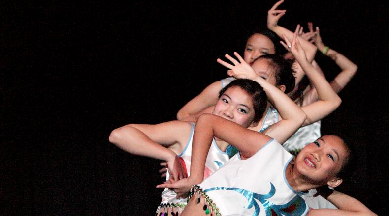 Dancers show a Chinese flair on the formal stage during the international festival, A World A’Fair, at the Dayton Convention Center in May 2010. FILE