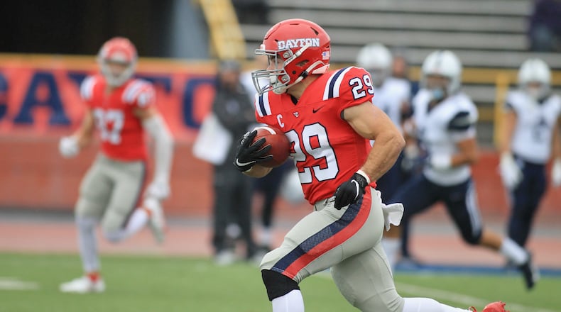 Dayton's Jake Chisholm runs for a touchdown after a catch in the first quarter against Butler on Saturday, Oct. 30, 2021, at Welcome Stadium. David Jablonski/Staff