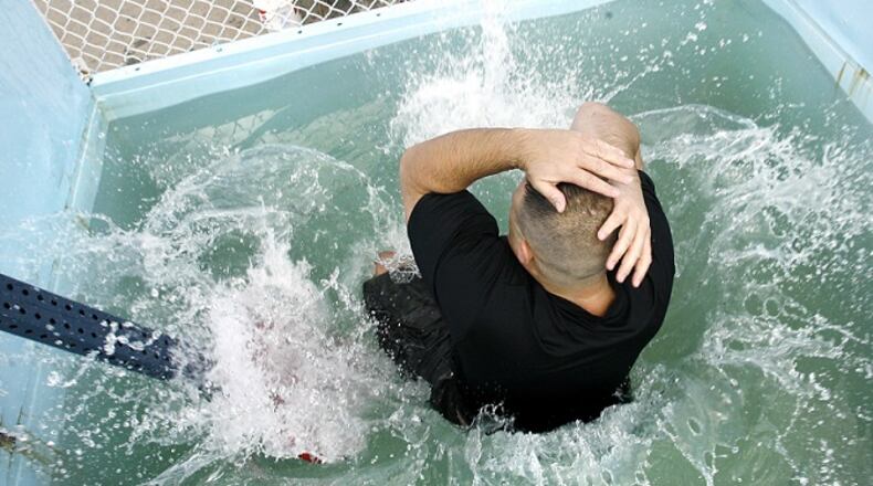 In this Springfield News-Sun file photo from 2008, a Clark County sheriff's deputy takes a plunged in a dunk tank. Staff File Photo by Barbara J. Perenic