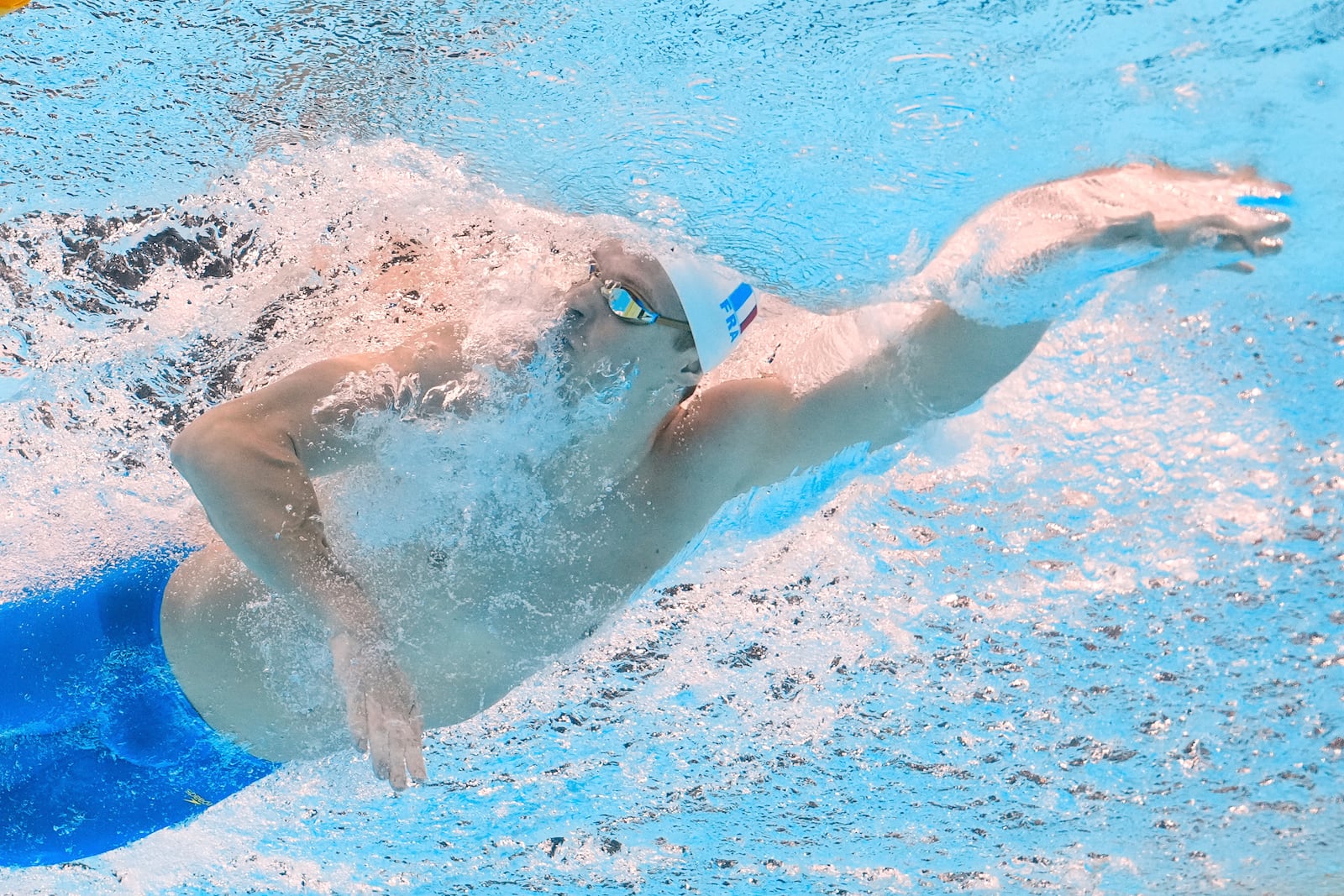 Leon Marchand of France competes in the men's 200-meter individual medley semifinal at the World Aquatics Championships in Singapore, Wednesday, July 30, 2025. (AP Photo/Lee Jin-man)