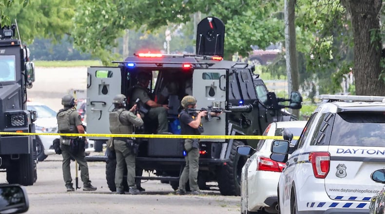 A large police presence was reported outside a house in the 300 block of Smith Street in Dayton on Friday, July 25, 2025. BRYANT BILLING / STAFF