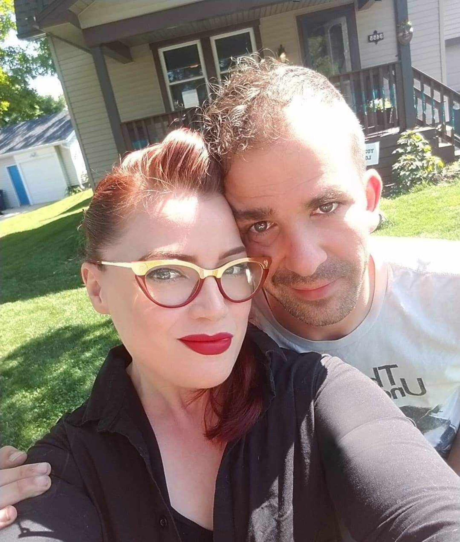 Kristina Bilbrey and Johnathon Gallienne in front of their home on Marimont Drive. CONTRIBUTED