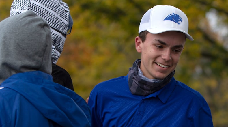 Springboro senior Jordan Gilkison is congratulated by teammates after winning the Division I state golf championship Saturday at Ohio State. Jeff Gilbert/CONTRIBUTED