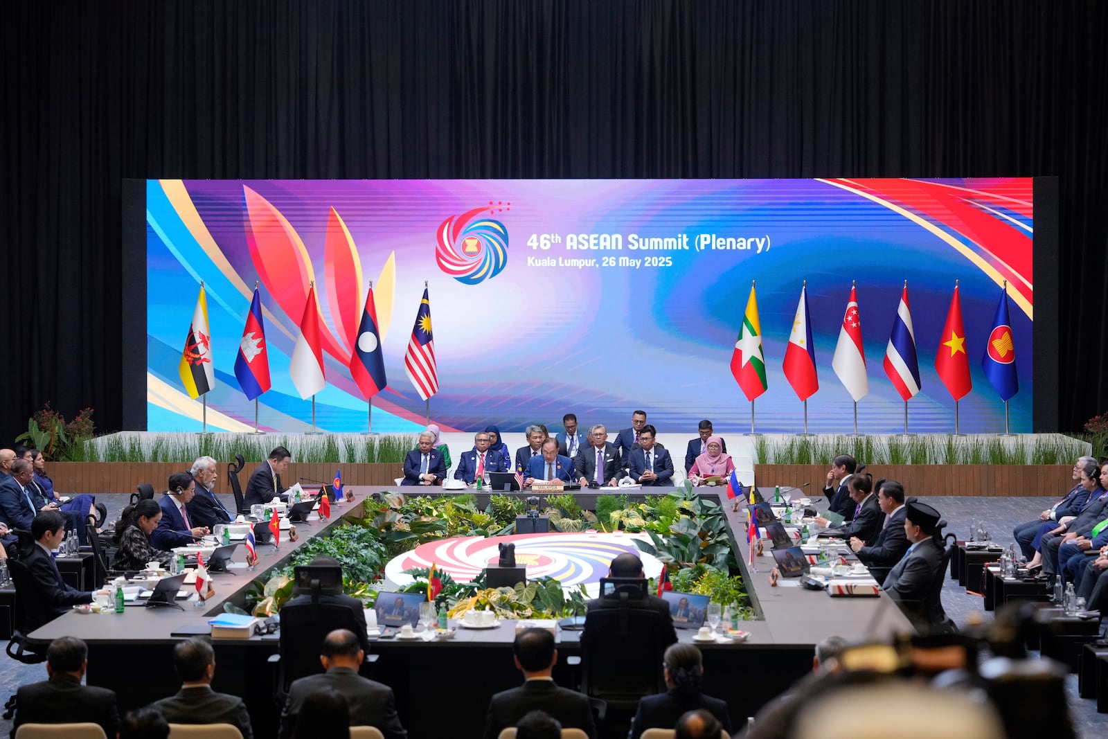 Malaysia's Prime Minister Anwar Ibrahim, center, together with others ASEAN countries leaders attends the plenary session at the Association of Southeast Asian Nations (ASEAN) Summit in Kuala Lumpur, Malaysia, Monday, May 26, 2025. (AP Photo/Vincent Thian)