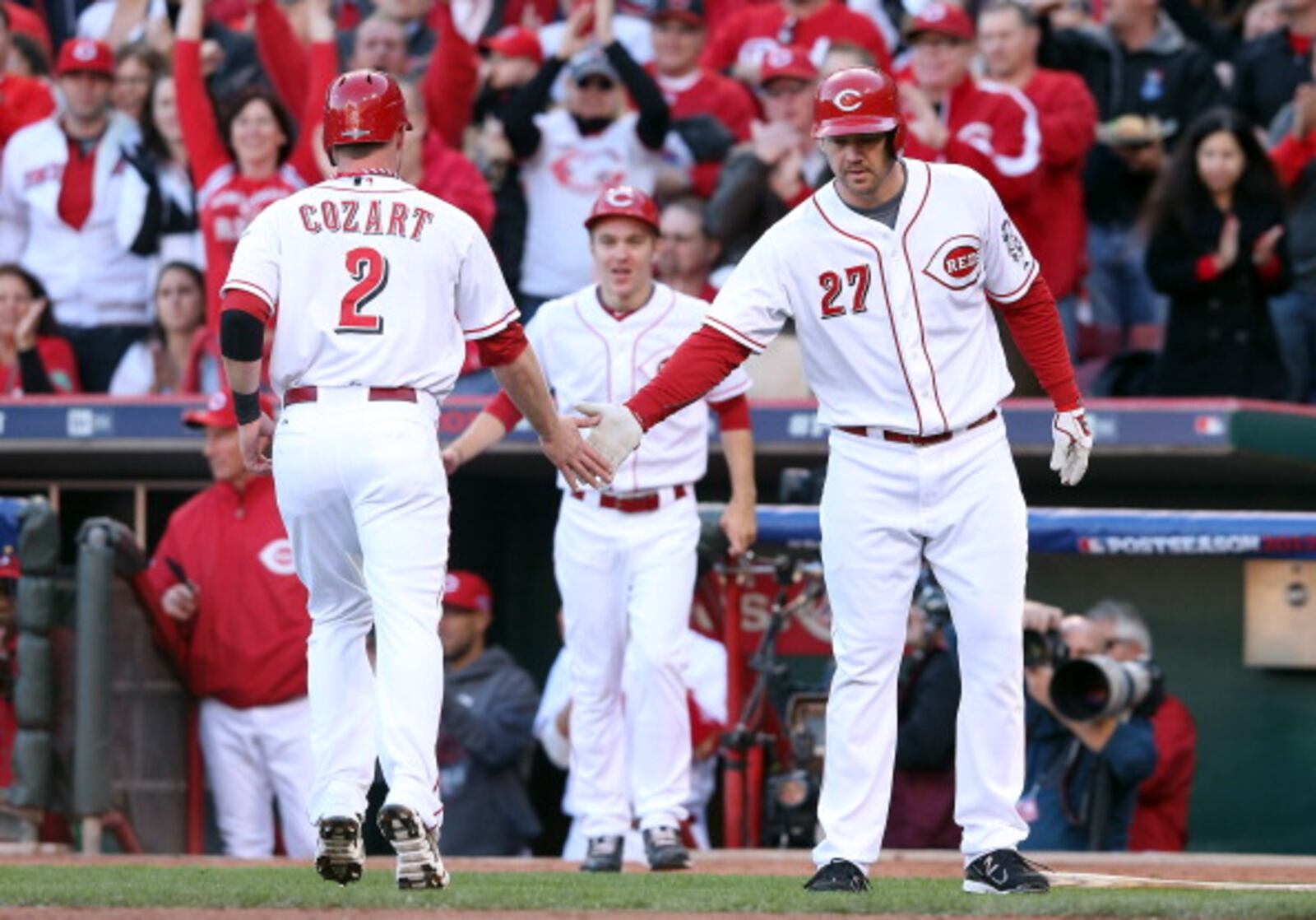 CINCINNATI, OH - OCTOBER 09: Zack Cozart #2 of the Cincinnati Reds scores as he is congratulated by Scott Rolen #27 in the first inning against the San Francisco Giants in Game Three of the National League Division Series at the Great American Ball Park on October 9, 2012 in Cincinnati, Ohio. (Photo by Andy Lyons/Getty Images)