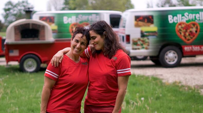 Elizabeth Corrado Weizman, left, and Gail Corrado Okafor, sisters and founders of Bella Sorella, a popular food truck serving up Neopolitan-style pizzas since 2013, are planning a restaurant in Tipp City. FILE PHOTO/CONTRIBUTED