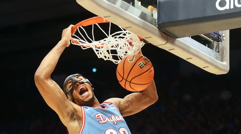 Dayton's Zed Key dunks against Marquette on Saturday, Dec. 14, 2024, at UD Arena. David Jablonski/Staff