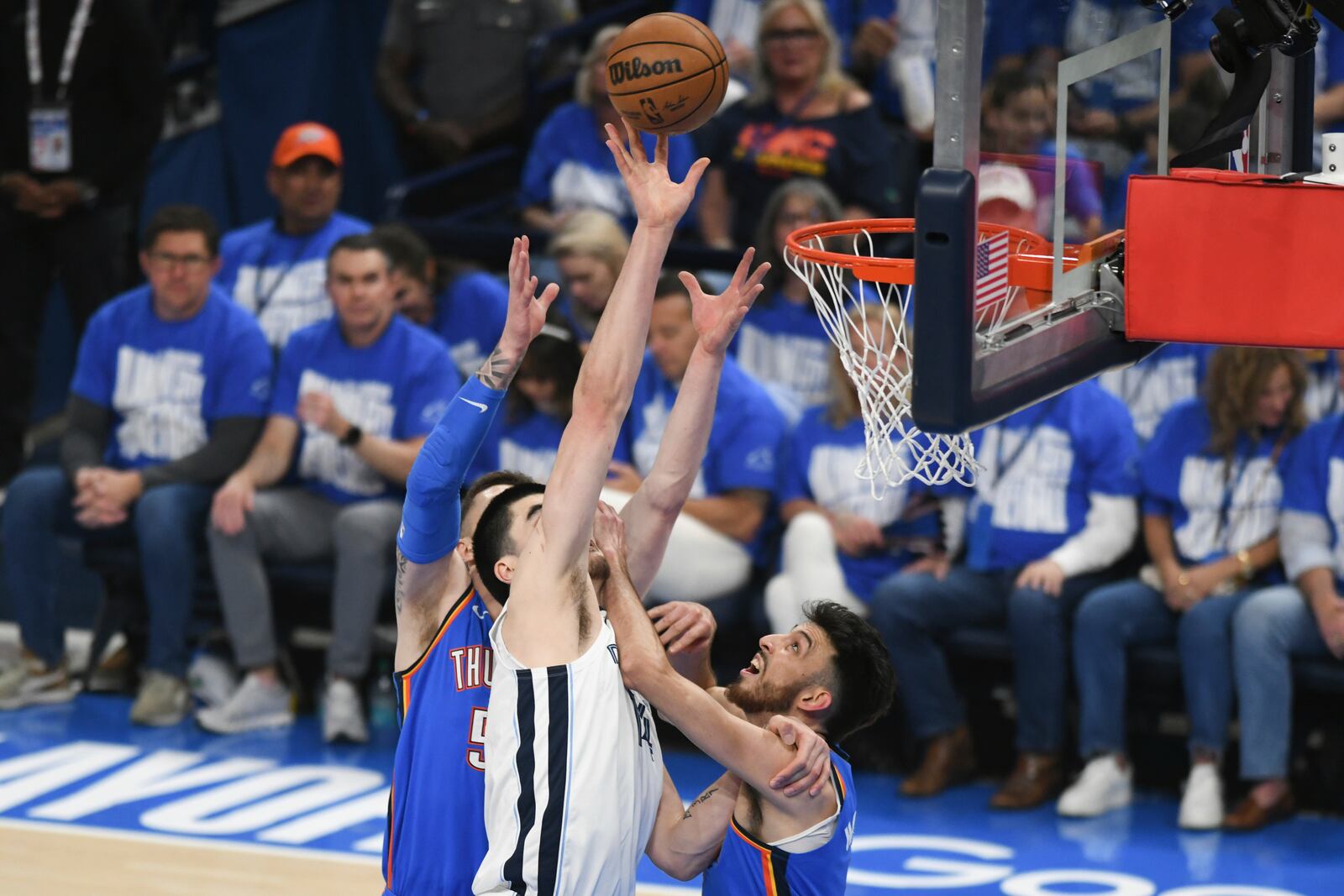 Memphis Grizzlies center Zach Edey, middle, shoots over Oklahoma City Thunder center Isaiah Hartenstein, left, and forward Chet Holmgren, right, during the first half in Game 1 of an NBA first-round playoff series, Tuesday, April 22, 2025, in Oklahoma City. (AP Photo/Kyle Phillips)