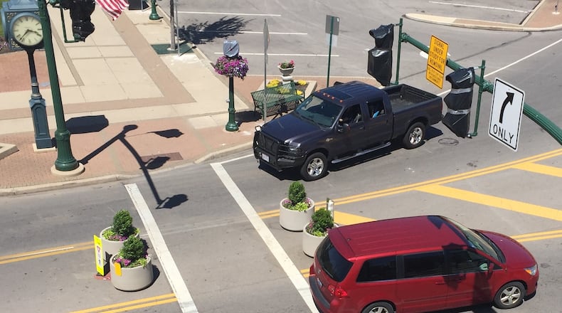 Troy officials began work Monday, June 4, 2018, on a road diet, making changes to some busy downtown streets in order to improve safety and flow in the square area. STAFF/STEVE BAKER