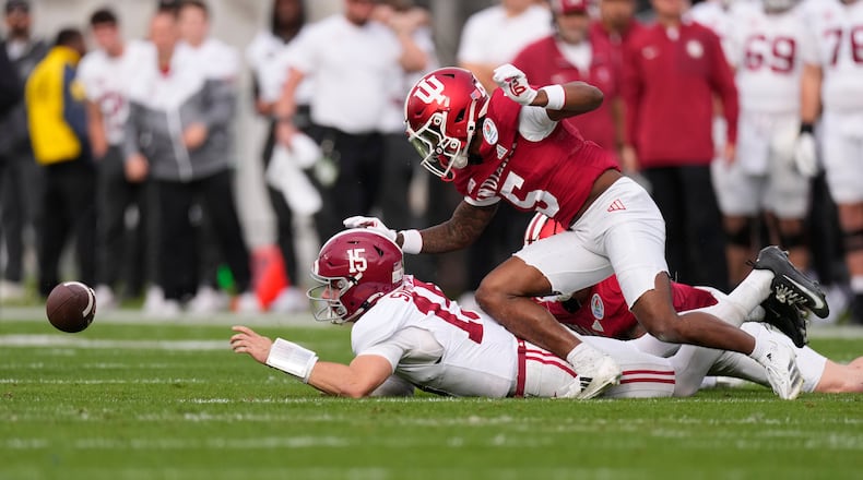 Alabama quarterback Ty Simpson, left, fumbles as he is hit by Indiana defensive back D'Angelo Ponds (5) during the first half of the Rose Bowl College Football Playoff quarterfinal game Thursday, Jan. 1, 2026, in Pasadena, Calif. (AP Photo/Mark J. Terrill)