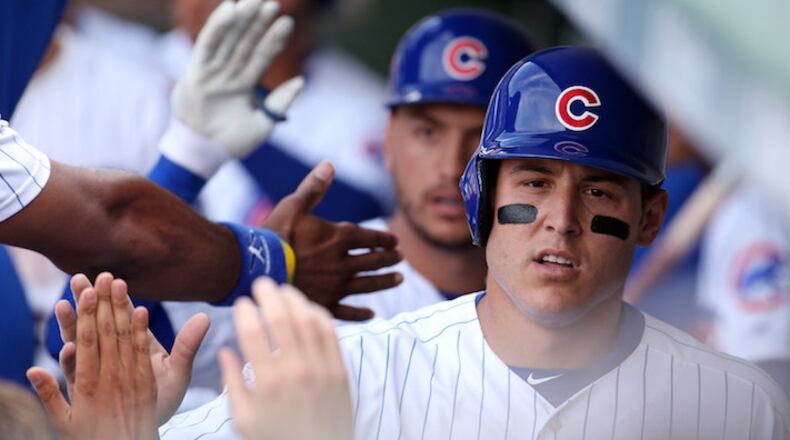 Chicago Cubs first baseman Anthony Rizzo is greeted in the dugout after scoring against the Chicago White Sox on July 25, 2017, at Wrigley Field in Chicago. (Brian Cassella/Chicago Tribune/TNS)