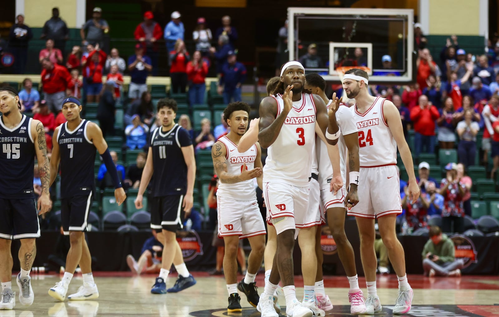 Dayton's Jaiun Simon claps as he heads to the free-throw in the final second of a victory against Georgetown on Thursday, Nov. 27, 2025, at the State Farm Field House in Kissimmee, Fla. David Jablonski/Staff