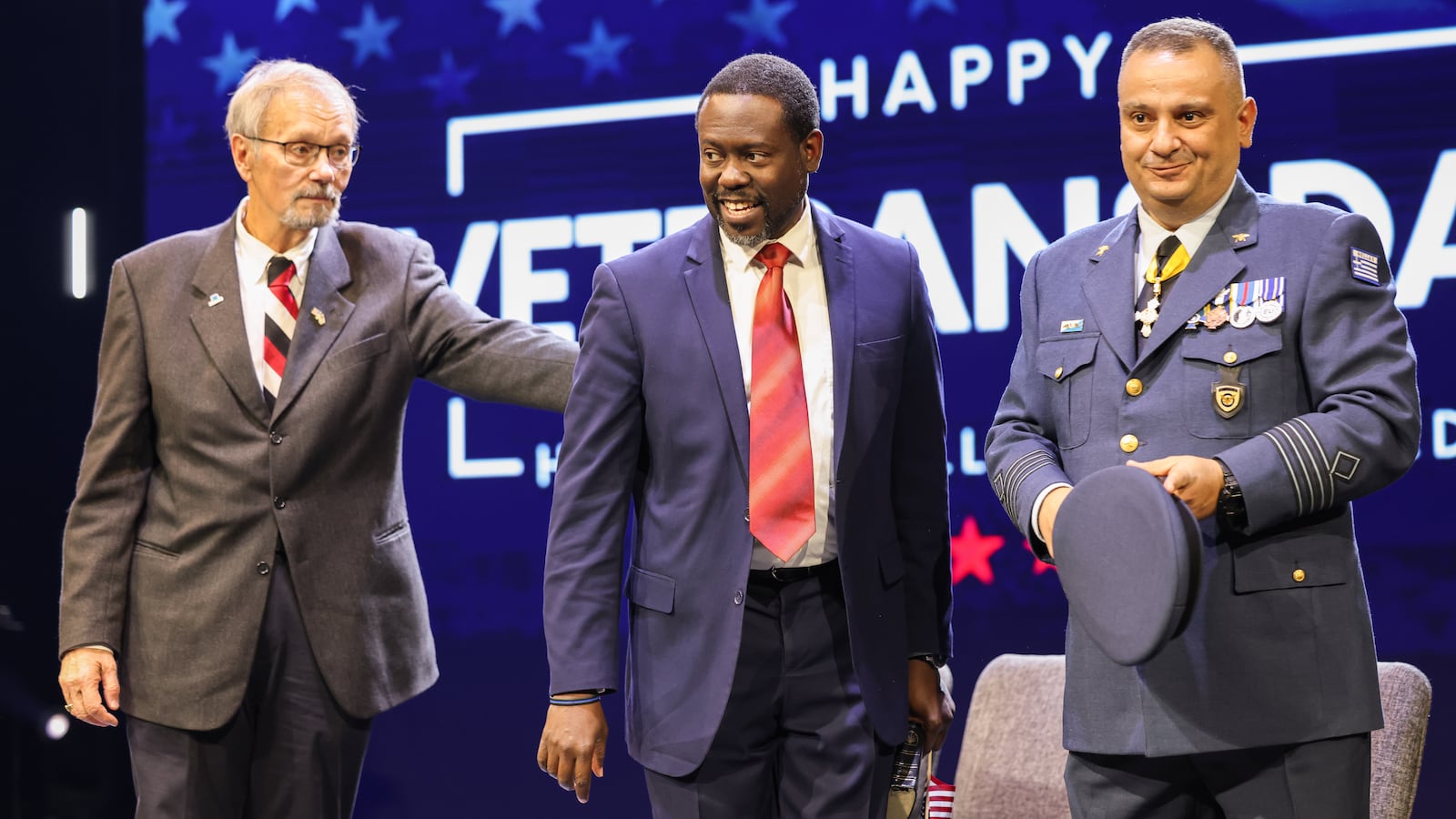 From left to right, Beavercreek Mayor Don Adams, Beavercreek Seventh-day Adventist Church pastor Delthony Gordon and Col. Gerorgios Tzamalis of the Hellenic Air Force stand during a Veterans Day ceremony on Tuesday, Nov. 11 at Be Hope Church in Beavercreek. Tzamalis was a featured speaker and one of several members of international militaries to attend. BRYANT BILLING/STAFF
