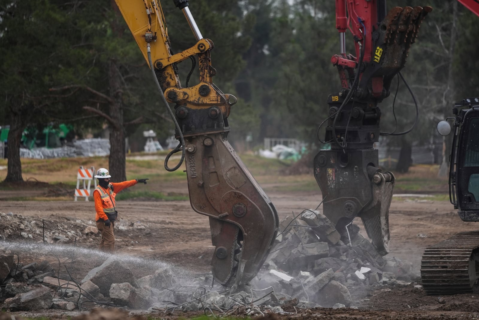 Debris from January wildfires is processed at a recycling facility set up on a golf course in Altadena, Calif., Wednesday, June 4, 2025. (AP Photo/Jae C. Hong)
