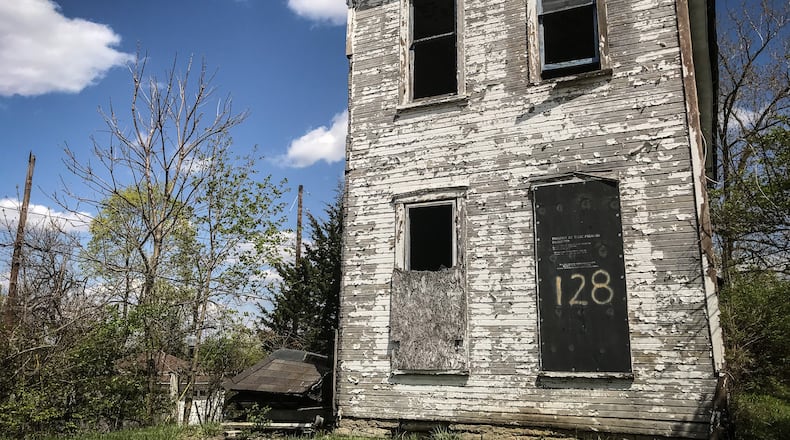 Lots where abandoned homes in Dayton’s Wolf Creek neighborhood once stood will be used for new single-family homes.