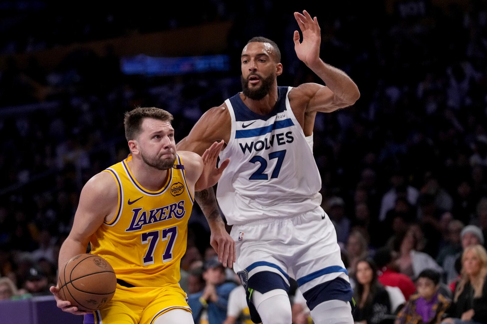 Los Angeles Lakers guard Luka Doncic (77) goes to the basket against Minnesota Timberwolves center Rudy Gobert (27) during the first half of Game 2 of an NBA first-round playoff series in Los Angeles, Tuesday, April 22, 2025. (AP Photo/Eric Thayer)