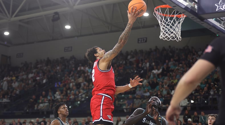 Dayton's De'Shayne Montgomery scores in the first half against North Carolina Wilmington in the first round of the National Invitation Championship on Saturday, March 21, 2026, at Trask Coliseum in Wilmington, N.C.. David Jablonski/Staff