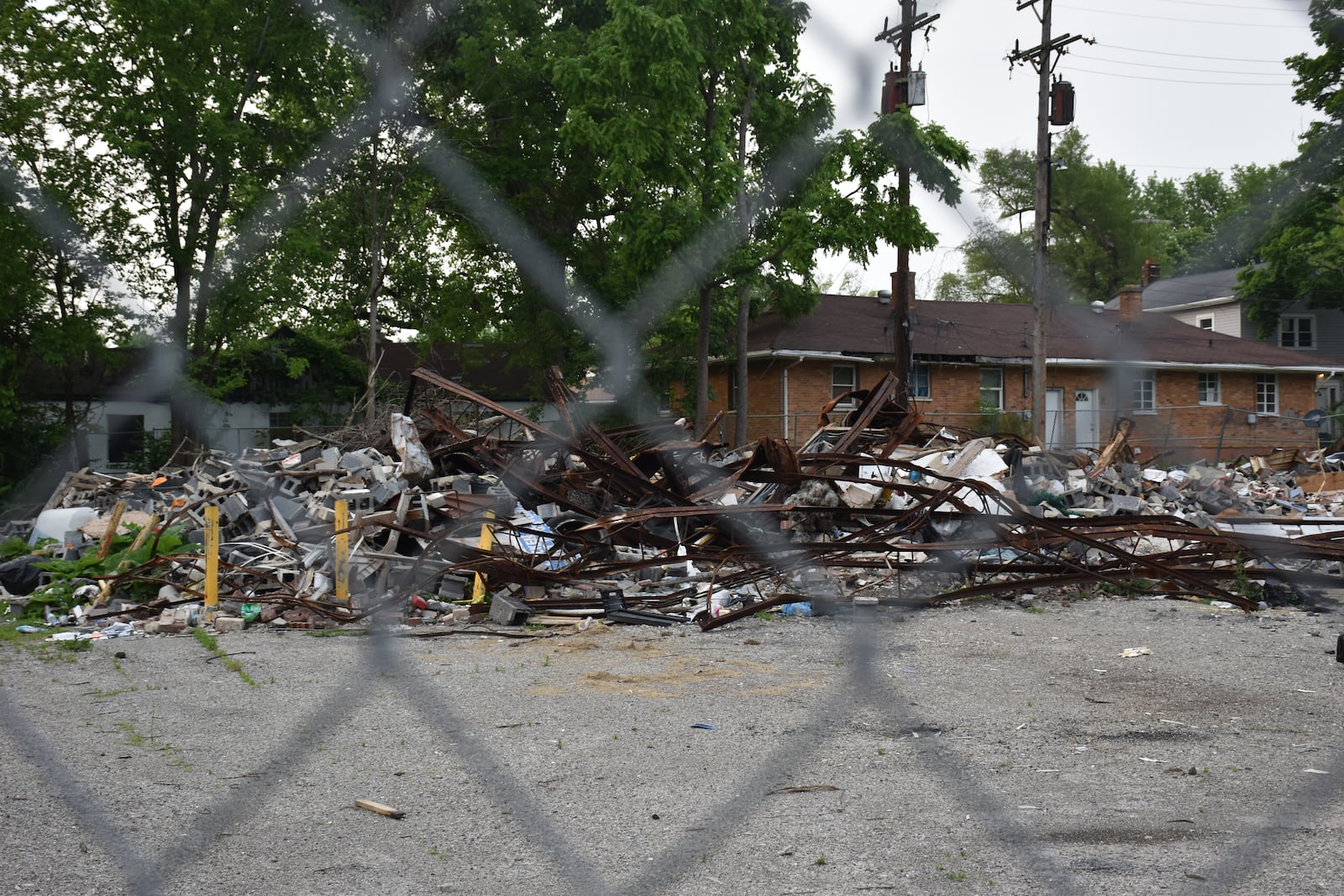 The Cornell Meat King Supermarket in northwest Dayton burned down on Oct. 31, 2025. Rubble remains on the site seven seven months later. CORNELIUS FROLIK / STAFF