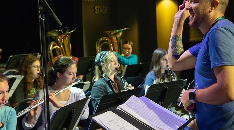 Kennon directing the band at Troy Christian school. He has worked there since 2014.