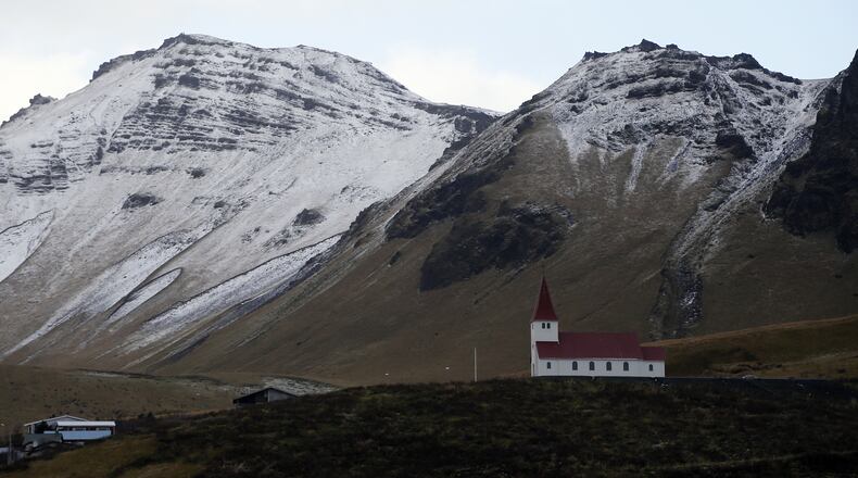 FILE - In this Oct. 26, 2016 file photo, the church of Vik, Iceland, near the Volcano Katla, After a summer of increased seismic activity at Katla, Icelanders are obsessing over the smallest sign of an eruption at the countryâs most closely watched volcano. Katla last erupted in 1918. Never before in recorded history, dating back to the 12th century, have 99 years passed without an eruption from the volcano. (AP Photo/Frank Augstein, File)