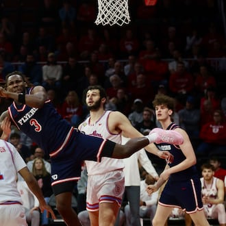 Dayton's Jaiun Simon draws a foul in the first half against Bradley in the first round of the National Invitation Championship on Wednesday, March 18, 2026, at Carver Arena in Peoria, Ill. David Jablonski/Staff