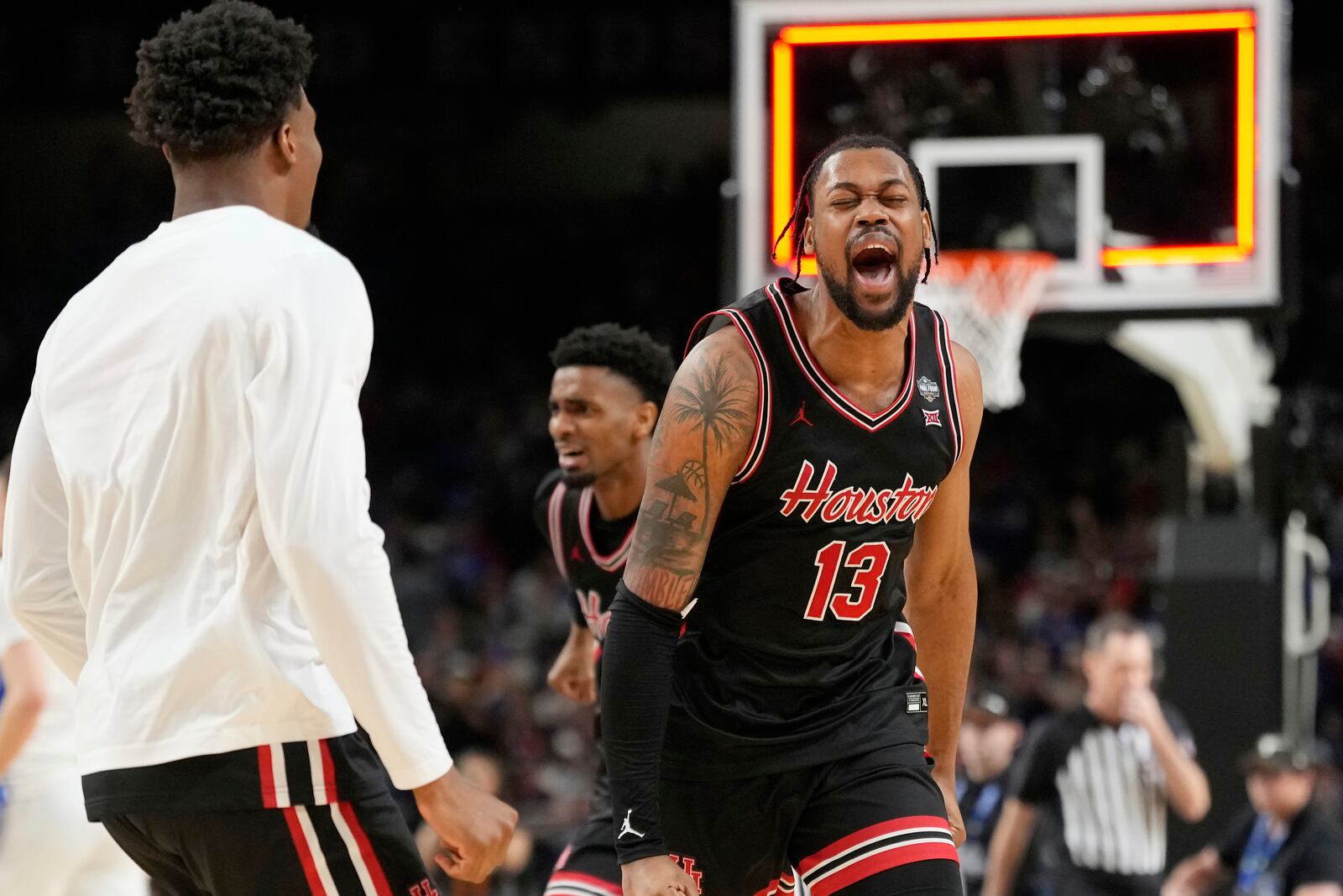 Houston's J'Wan Roberts (13) celebrates after Houston beat Duke in the national semifinals at the Final Four of the NCAA college basketball tournament, Saturday, April 5, 2025, in San Antonio. (AP Photo/Eric Gay)