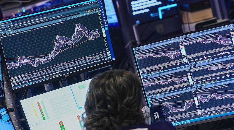 Specialist Michael Pistillo works at his post on the floor of the New York Stock Exchange, Friday, Jan. 2, 2026. (AP Photo/Richard Drew)