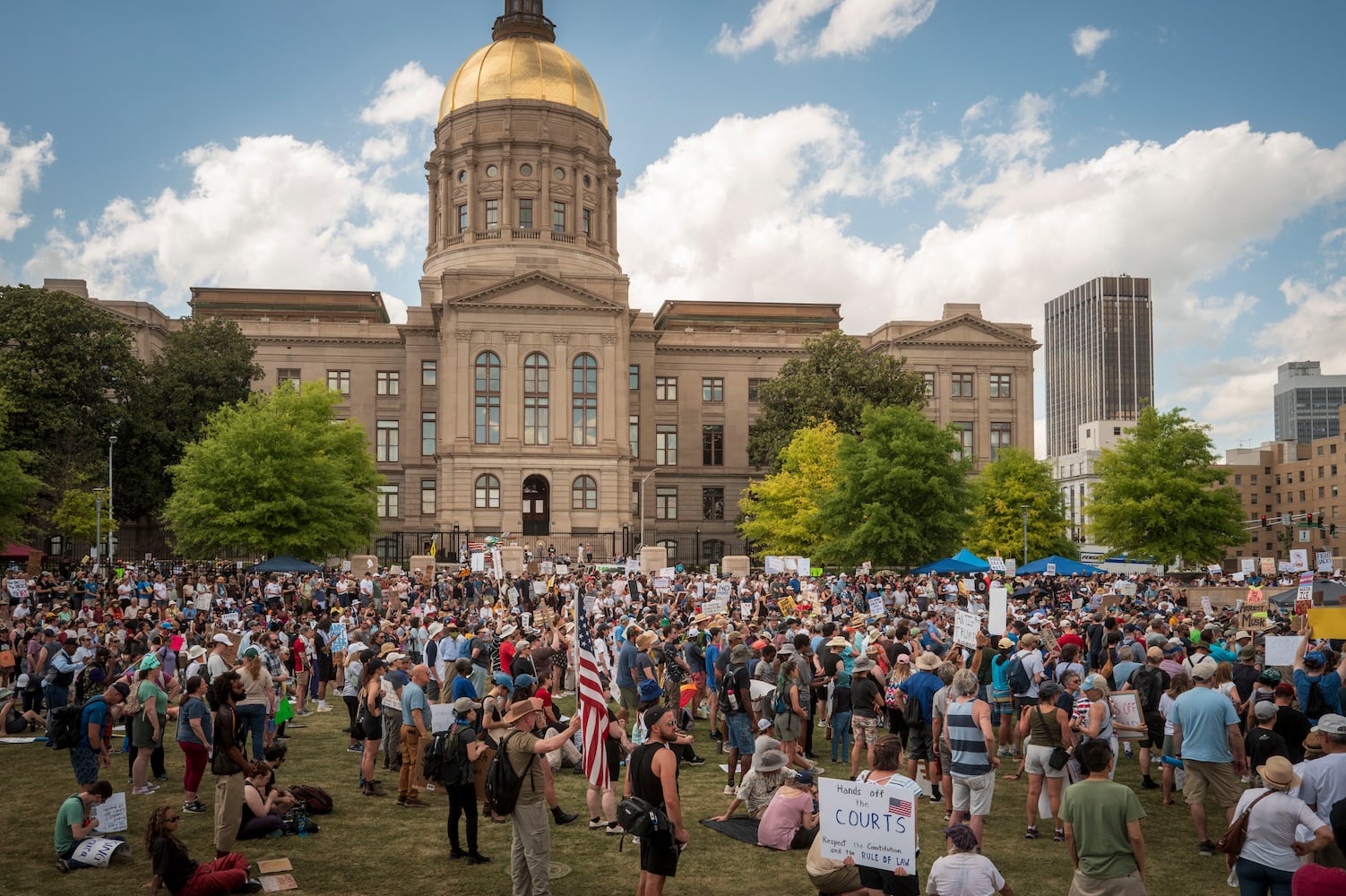 Protesters rally at the Georgia State Capitol in Atlanta during nationwide ÒHands Off!Ó demonstrations against President Donald TrumpÕs administration, on Saturday, April 5, 2025. (Audra Melton/The New York Times)