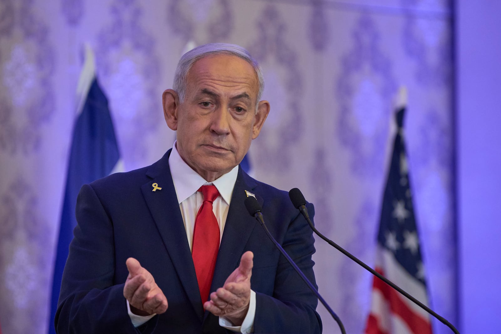 Israeli Prime Minister Benjamin Netanyahu speaks to the audience at a conference in Jerusalem, Sunday, July 27, 2025. (AP Photo/Ohad Zwigenberg)